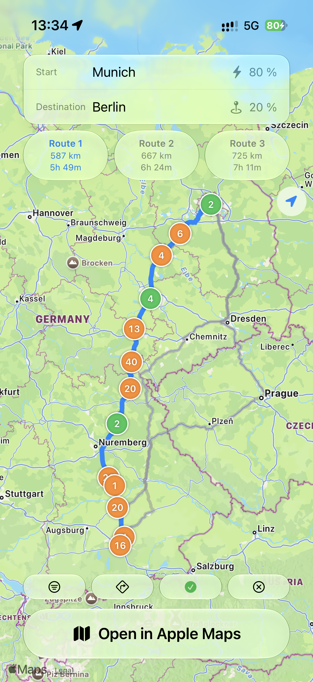 Route planning screen showing charging stops between Munich and Berlin